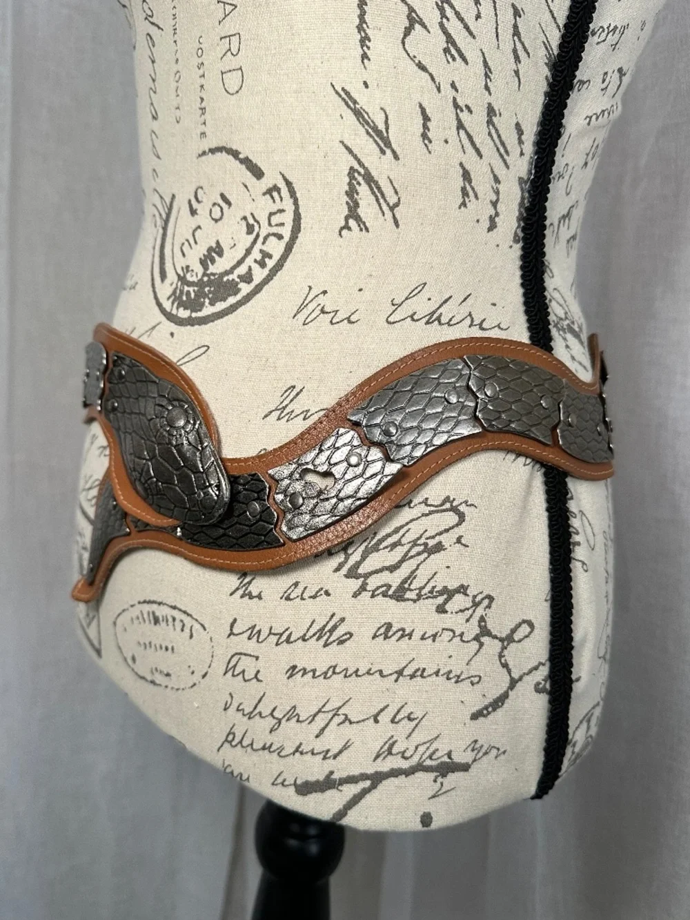 Vintage brown leather and silver colored metal articulated snake belt